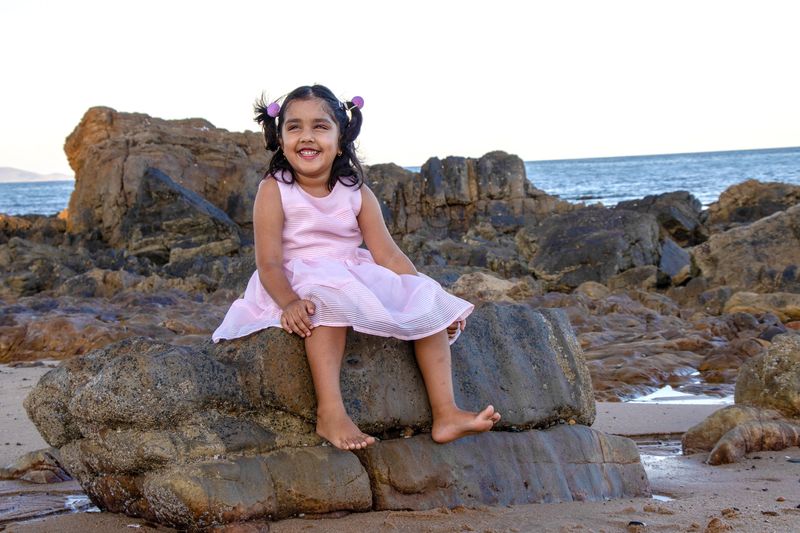 Child portrait — rocks and sea